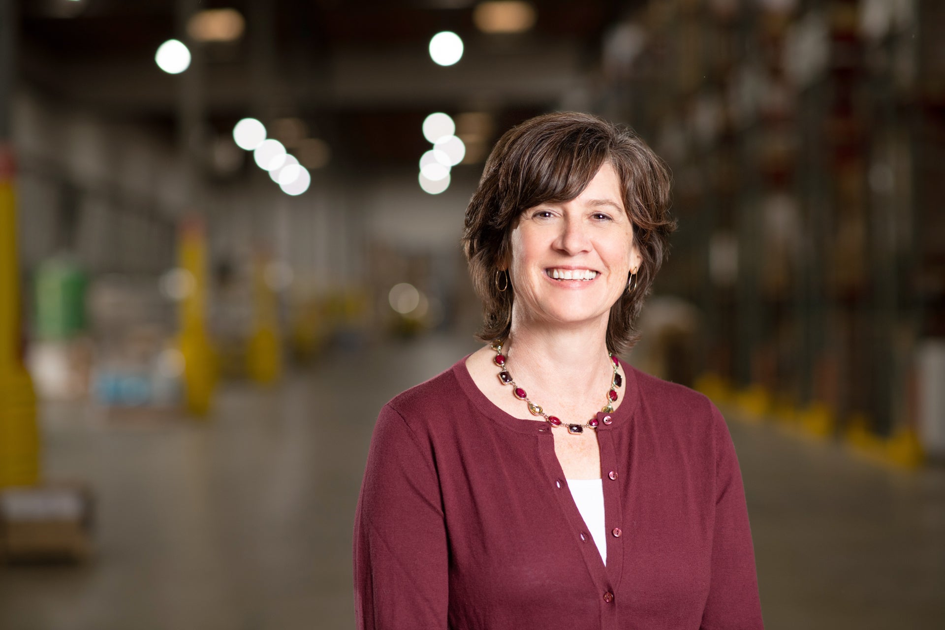 Amy Swanson standing in WCP Warehouse