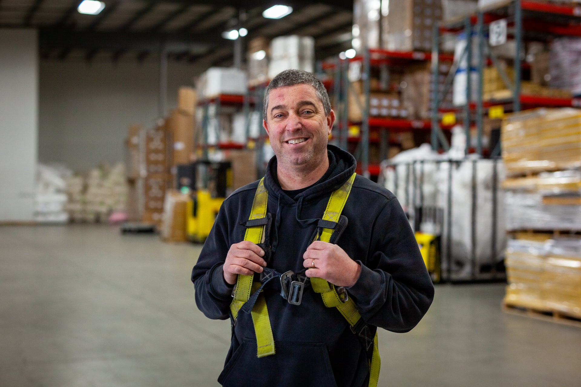 Photo of Dan Moore standing in the warehouse at WCP Solutions in Medford, Oregon