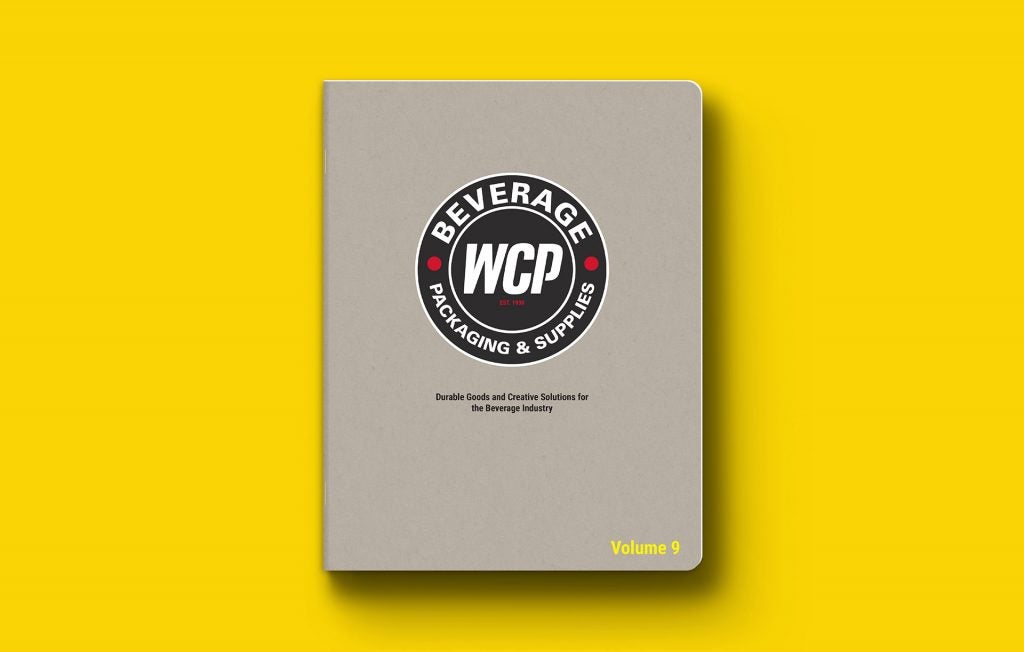 WCP Beverage Catalog laying face up on a yellow background