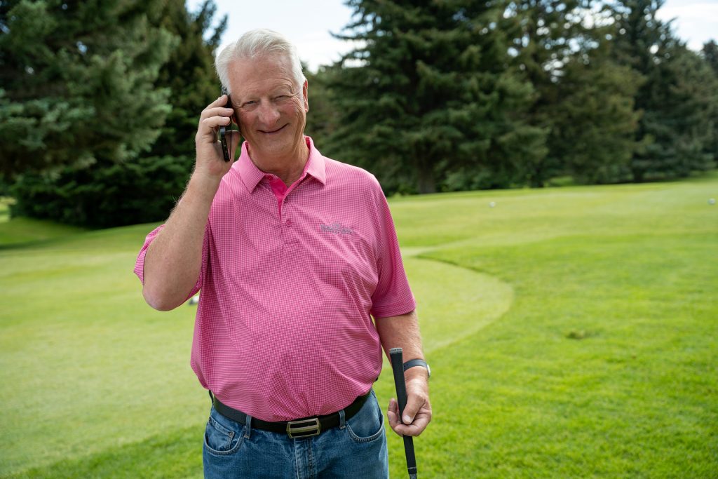 Mike taking a business call while out of the office