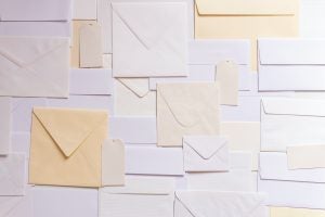 Different types of envelopes laid out flat on a table