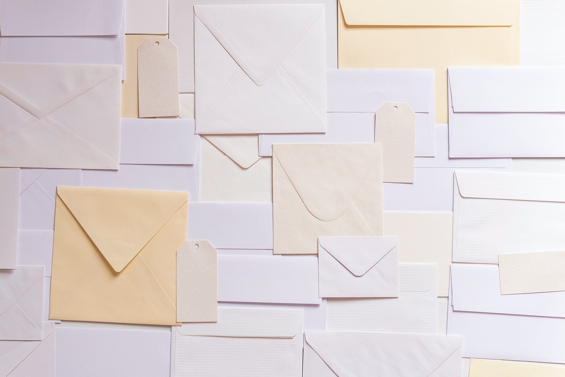 Different types of envelopes laid out flat on a table