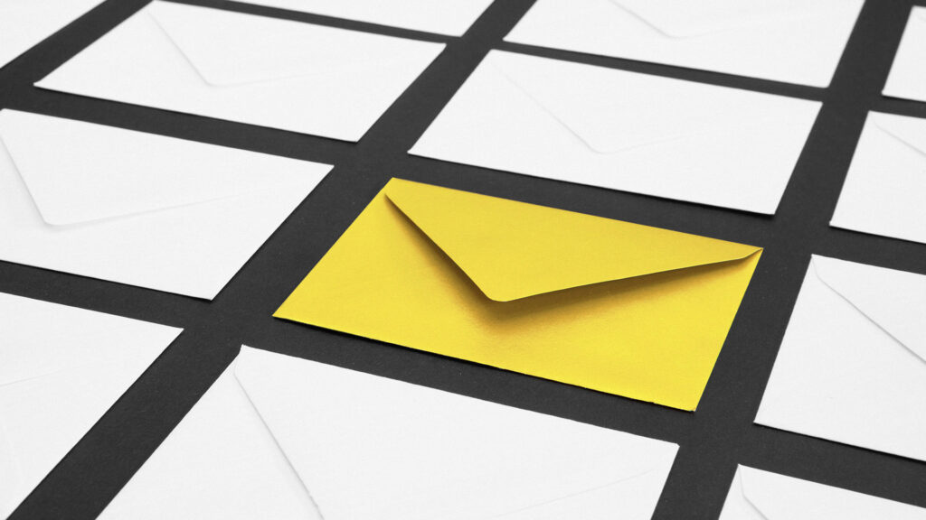 Yellow and white envelopes on a table