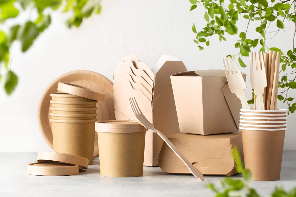 a grouping of kraft food containers and cutlery