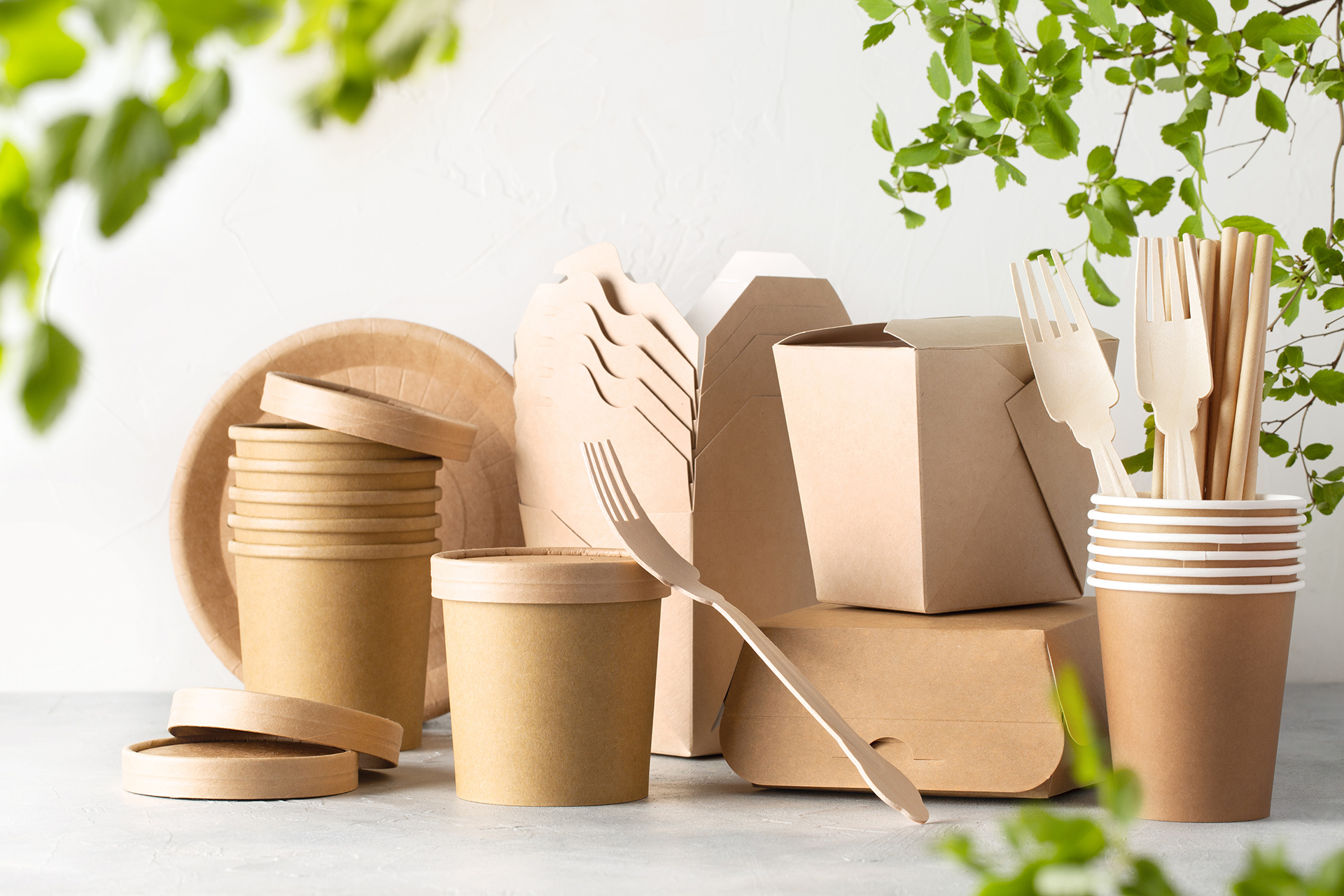 a grouping of kraft food containers and cutlery