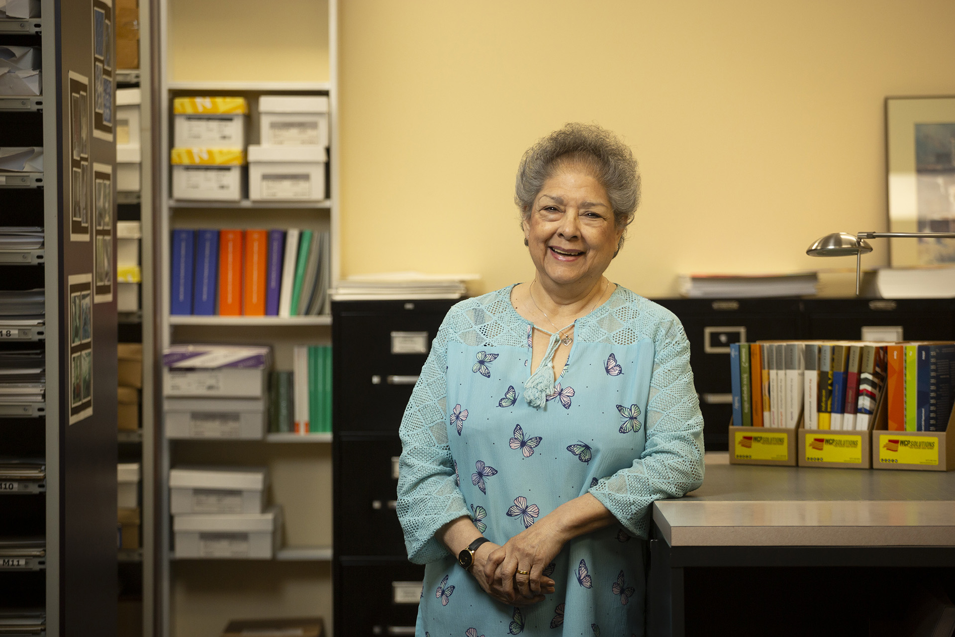 Pauline Beal, WCP sample coordinator, standing in the Kent, WA paper sample department at WCP Solutions