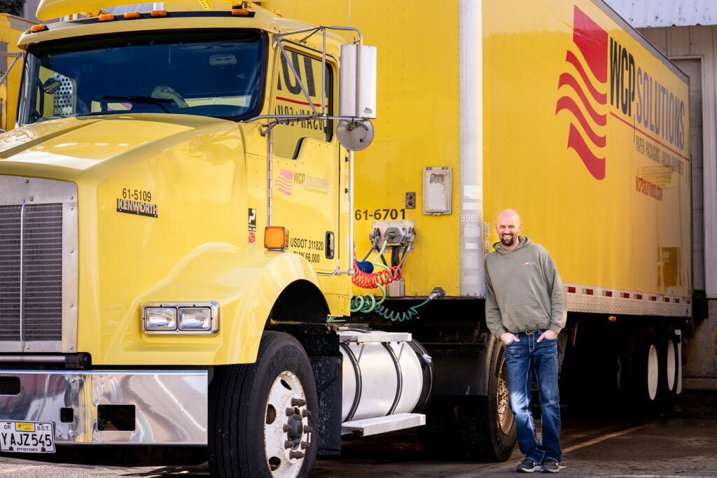 Joe Servel standing in front of his delivery truck in Idaho Falls