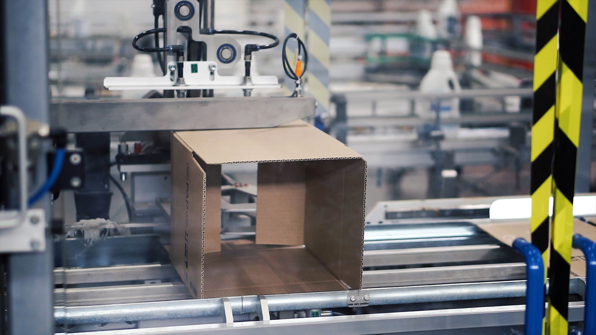 packaging equipment folding a box