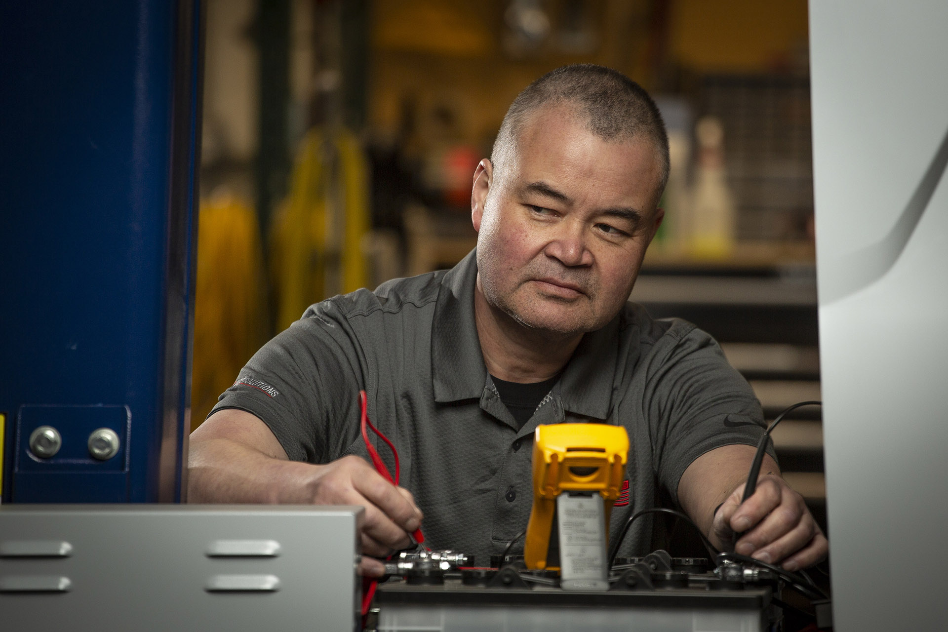 In-house equipment tech doing a service on packaging equipment at WCP Solutions.
