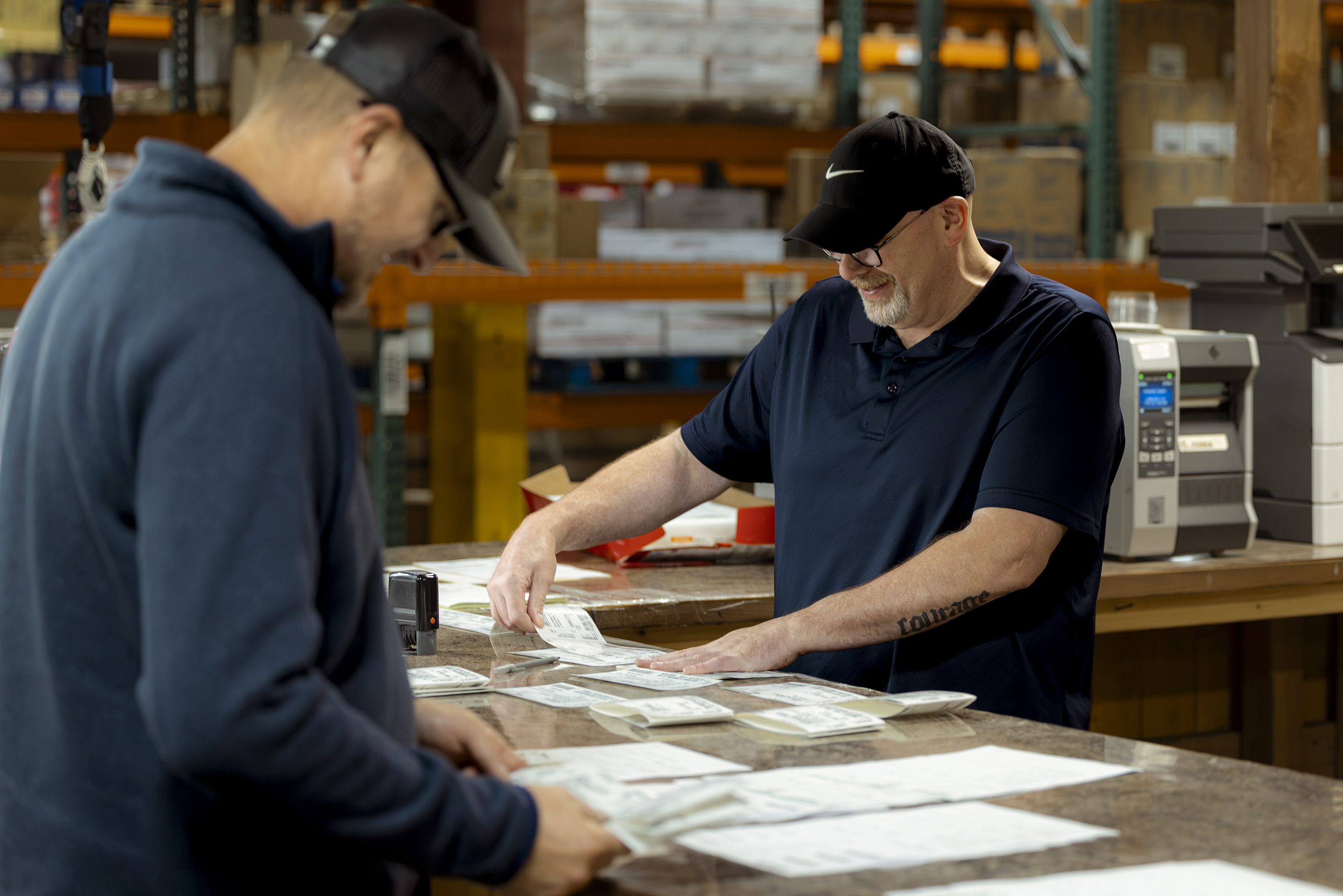 Dan Sutherland going through order paperwork